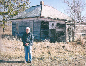 John Blomgren standing next to his families home that was 
located in Mine 18 Camp