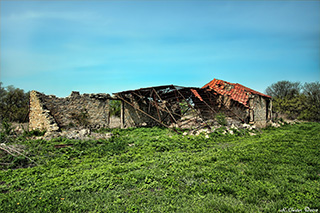 Photo of the railroad storage shed ruins in Buxton, IA