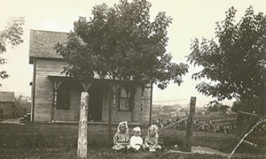 Helen, Edna and Evelyn Sitting in the Front Yard