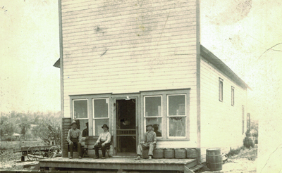 Peterson store in Consol, IA circa 1918. Adolf Nylander in center, David Peterson on right, unknown on the left. Consol post office was located in front of the store.